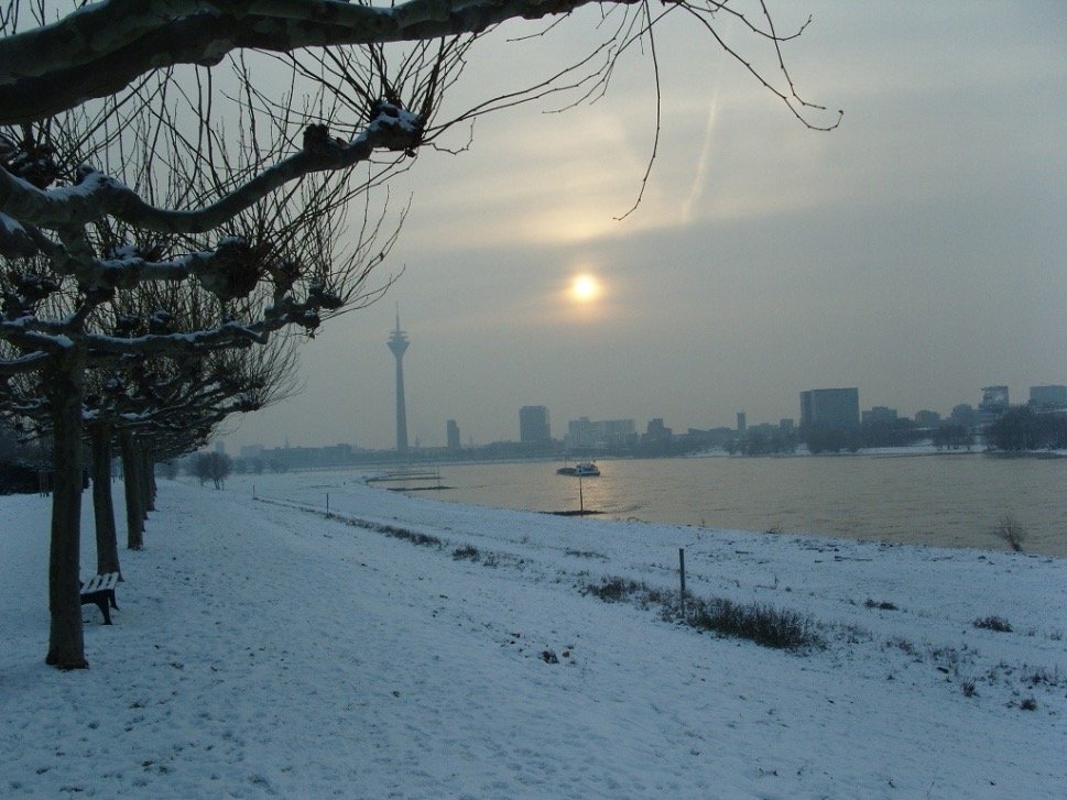 City horizon, river and snow covered banks