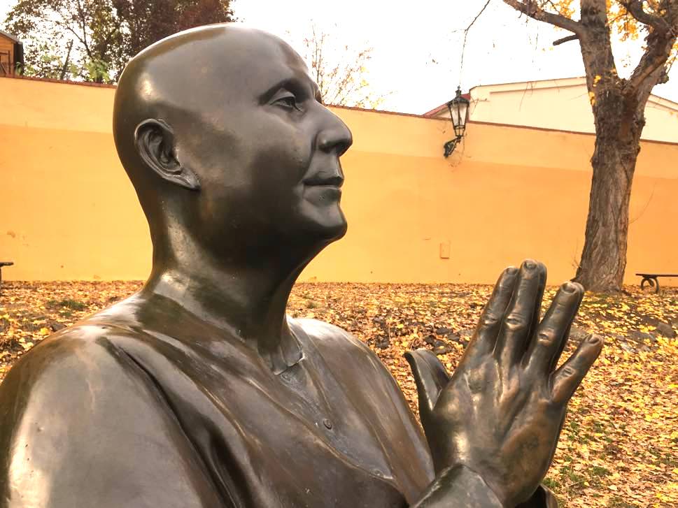 Statue of priest praying