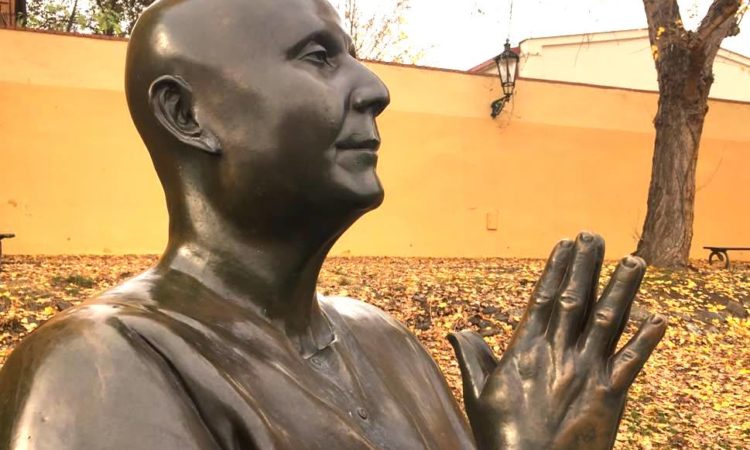 Statue of priest praying